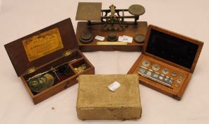 A set of postal scales and cased scientific weights