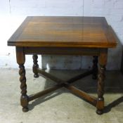 An oak barley twist drawer leaf table