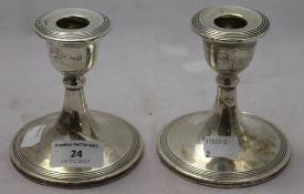 A pair of silver candlesticks