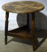 A carved cricket table