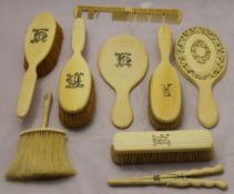 A 19th century Canton carved ivory hand mirror and other Victorian ivory dressing table items