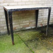 A wrought iron garden table