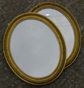 Two Victorian gilt framed oval wall mirrors