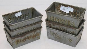 Six small Hovis tins