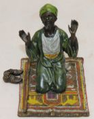 A cold painted bronze in the form of an Arab