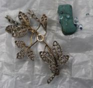 An unmarked gold leaf form brooch,