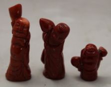 Three coral carved figures
