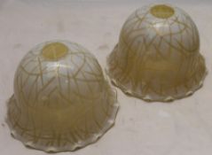 A pair of vaseline glass light shades