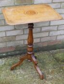 A 19th century inlaid oak tilt top tripod table