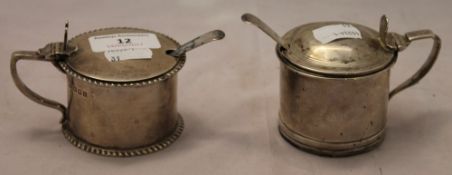 Two silver mustards