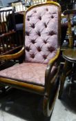 A Victorian upholstered rocking chair