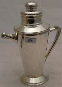 A silver plated swivel cocktail shaker