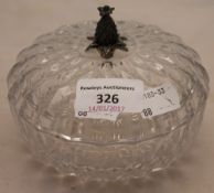 A silver top glass round box