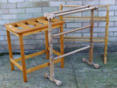 A luggage rack and two towel rails