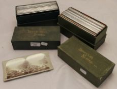 Two boxes containing binocular/stereoscopic slides