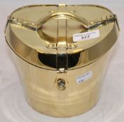 A miniature brass hat box