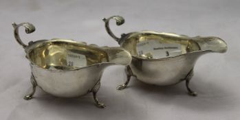 A pair of silver sauce boats