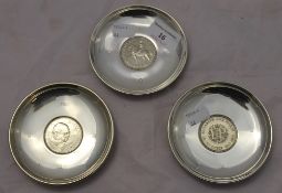 Three coin set silver dishes