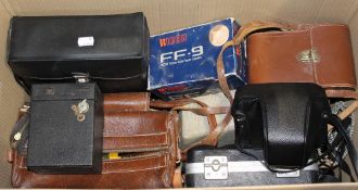A large cased pair of Kronos binoculars and various camera equipment