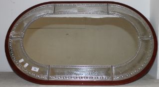 A silver plate mounted mirror