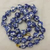A string of blue and white porcelain beads