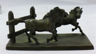 A small bronze figure of horses