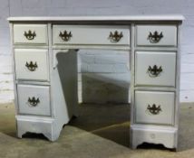 A white painted kneehole desk