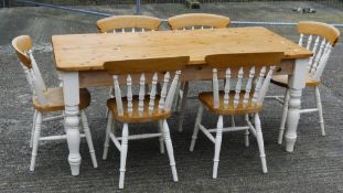 A modern white painted pine table and chairs