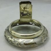 A silver overlay glass match holder