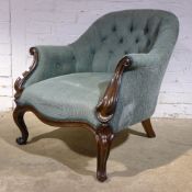 A Victorian rosewood framed upholstered armchair