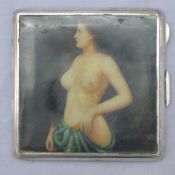 A silver cigarette case depicting a nude