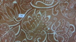 A large florally decorated fabric panel