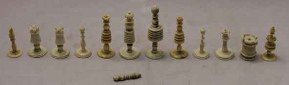 A quantity of carved ivory chess pieces