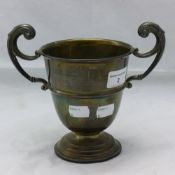 A silver twin handled trophy cup