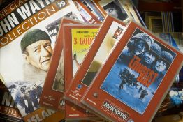 A large quantity of John Wayne literature, unopened DVDs,