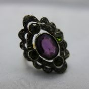 A 9 ct gold and amethyst set ring