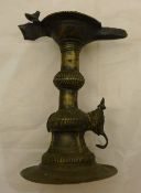 An Indian bronze lamp