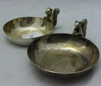 A pair of dishes decorated with squirrels