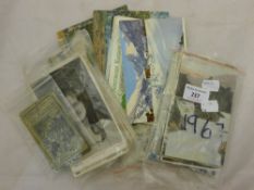 A quantity of various postcards
