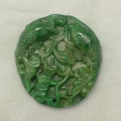 An apple green jade pendant