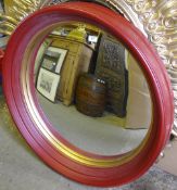 A red painted convex mirror