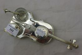 A silver plated violin shaped cruet set