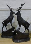 A pair of bronze stags