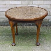 An early 20th century cane top coffee table