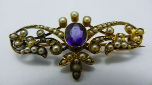 An Art Nouveau amethyst and seed pearl brooch