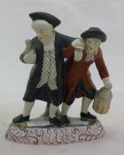 A 19th century Staffordshire figural group of two drunkards