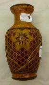A small Chinese vase with wicker work