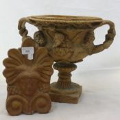 A terracotta urn and a ridge tile