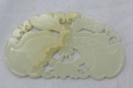 A white jade carving of a butterfly