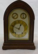 An Edwardian inlaid mahogany mantle clock
